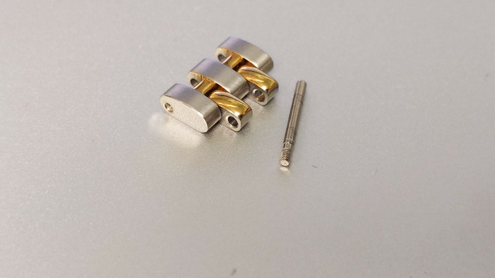 OMEGA LINKS S/S and Yellow 12mm x 6.9mm great condition. for watch repair