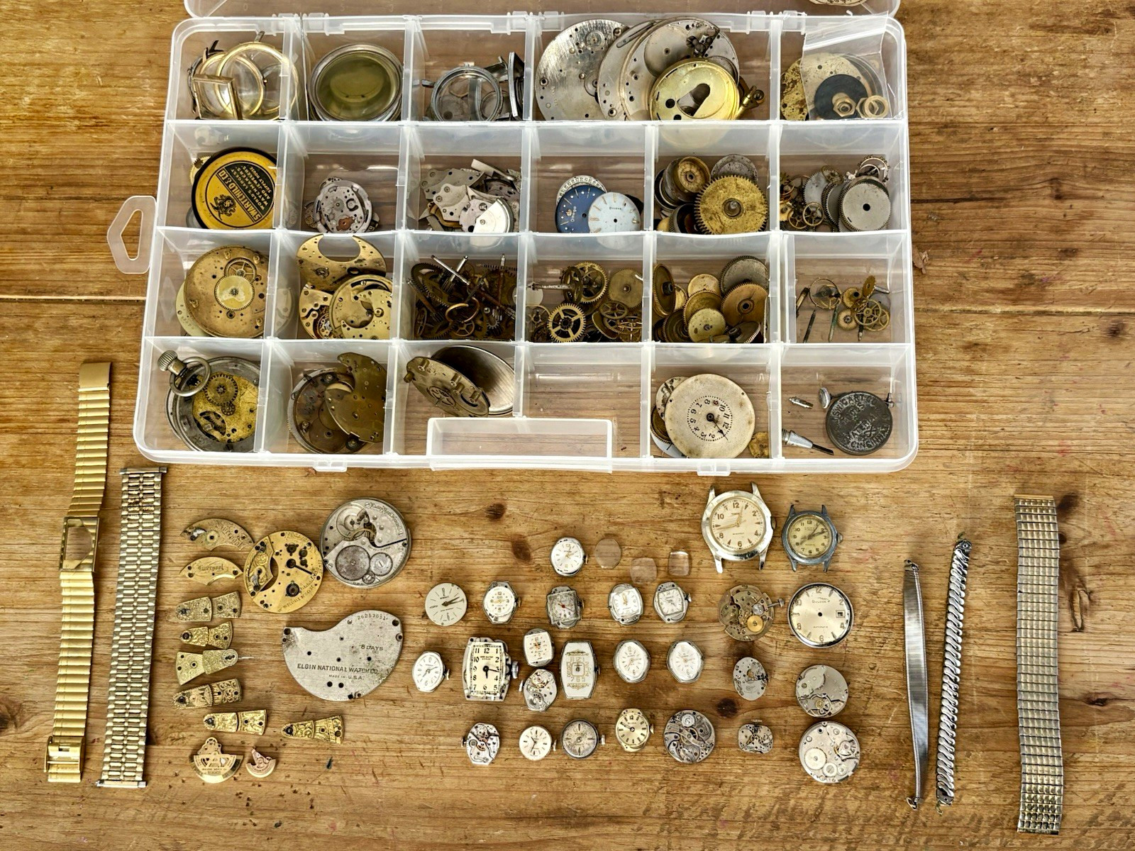 Watchmaker parts Lot w/ Box Movements Dials Gears Bulova Omega Benrus Elgin