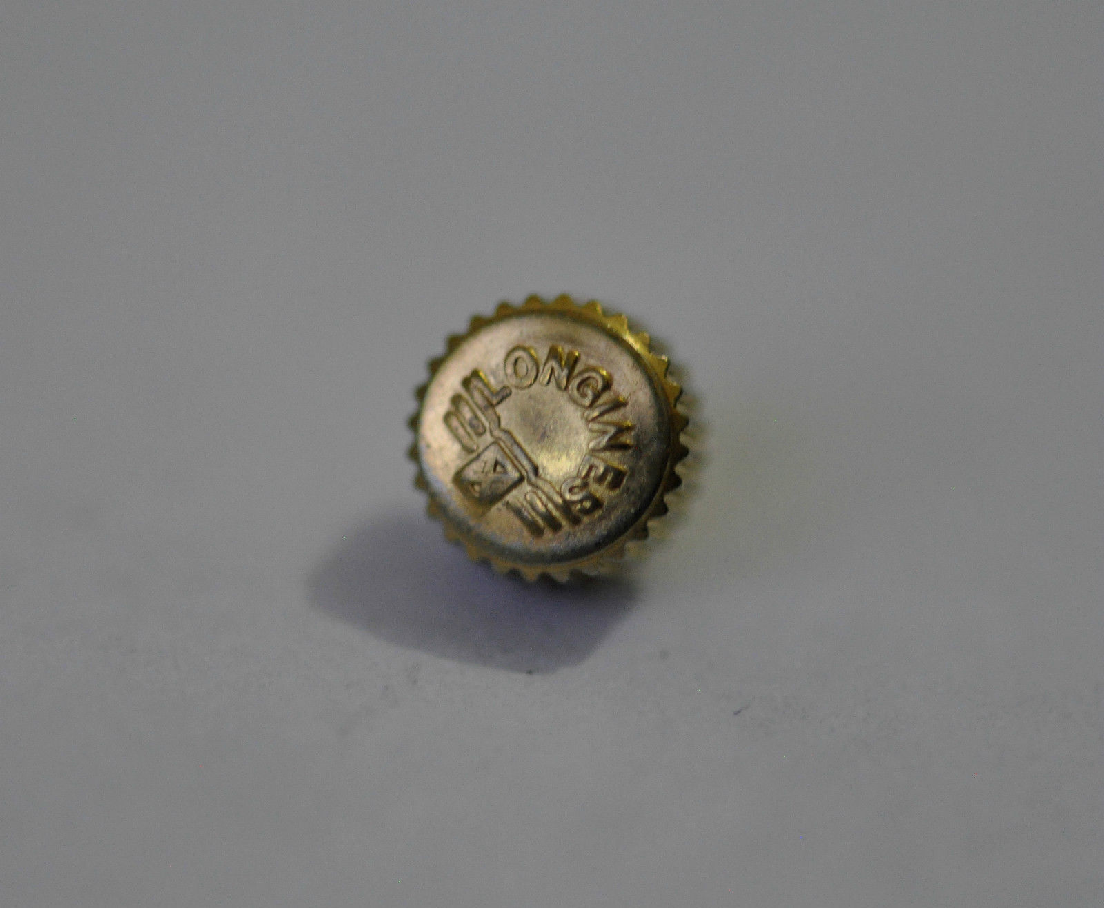 LONGINES YELLOW GOLD PLATED WATCH CROWN KEY (5.53mm x 3.07mm). (L-12)