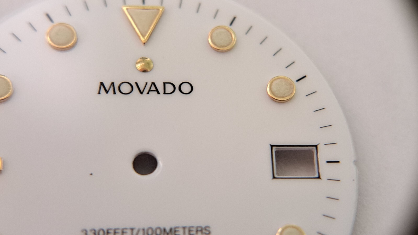 Movado DIAL white with green lume 28.9mm diameter. feet between2 and 3 o’clock a