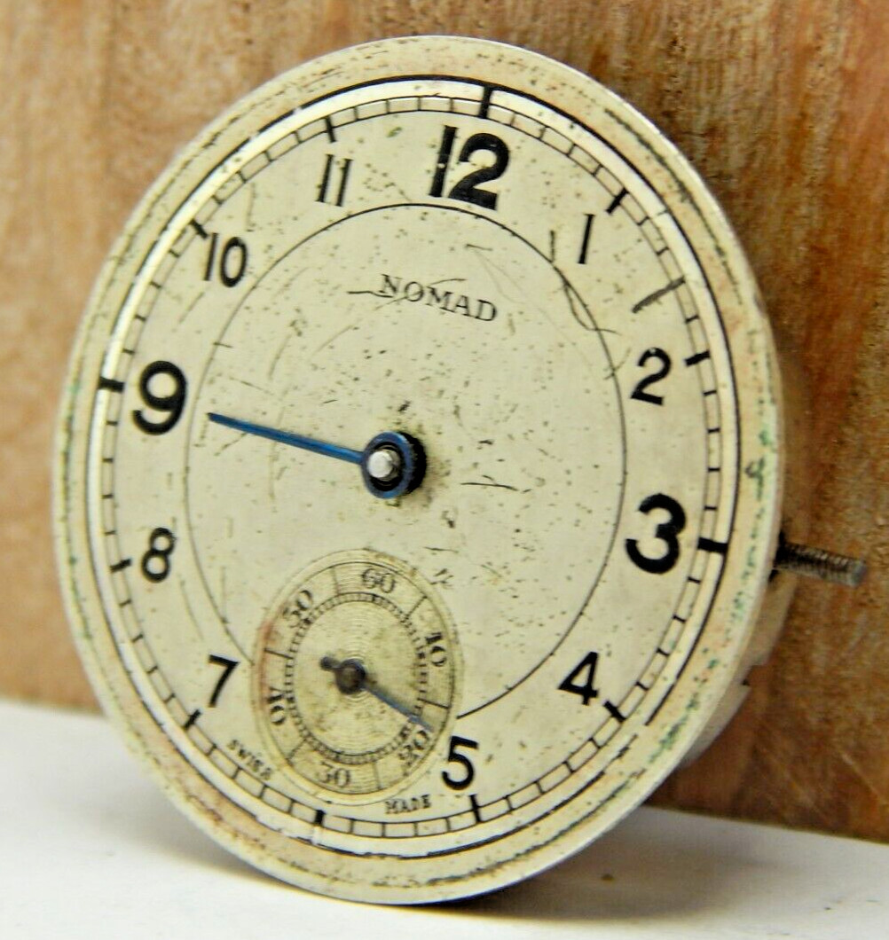 Vintage Nomad 15 jewel men’s 8/0s wrist watch movement with dial hands and stem