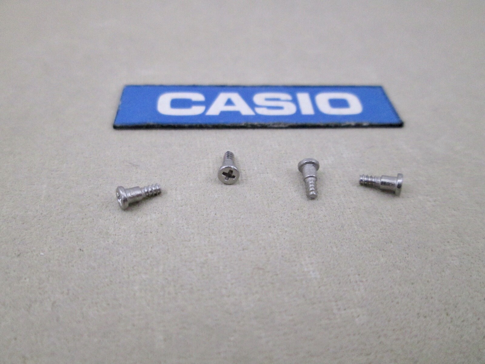 Genuine Casio DW-5900 DW-6900 G-2300 PAG-40 PRG-40 BG-169 bezel screws X 4