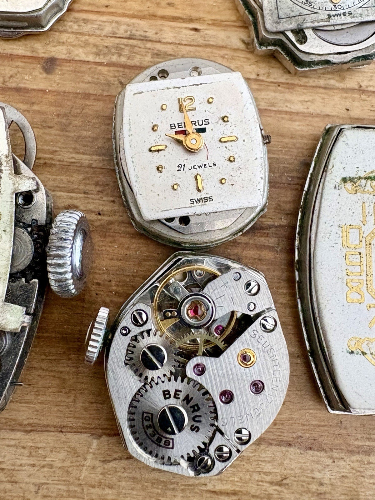Watchmaker parts Lot w/ Box Movements Dials Gears Bulova Omega Benrus Elgin