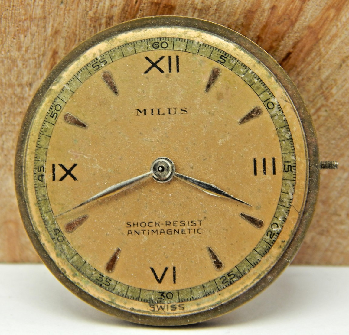 Vintage Milus 17 jewel men’s wrist watch movement with dial, hands and stem