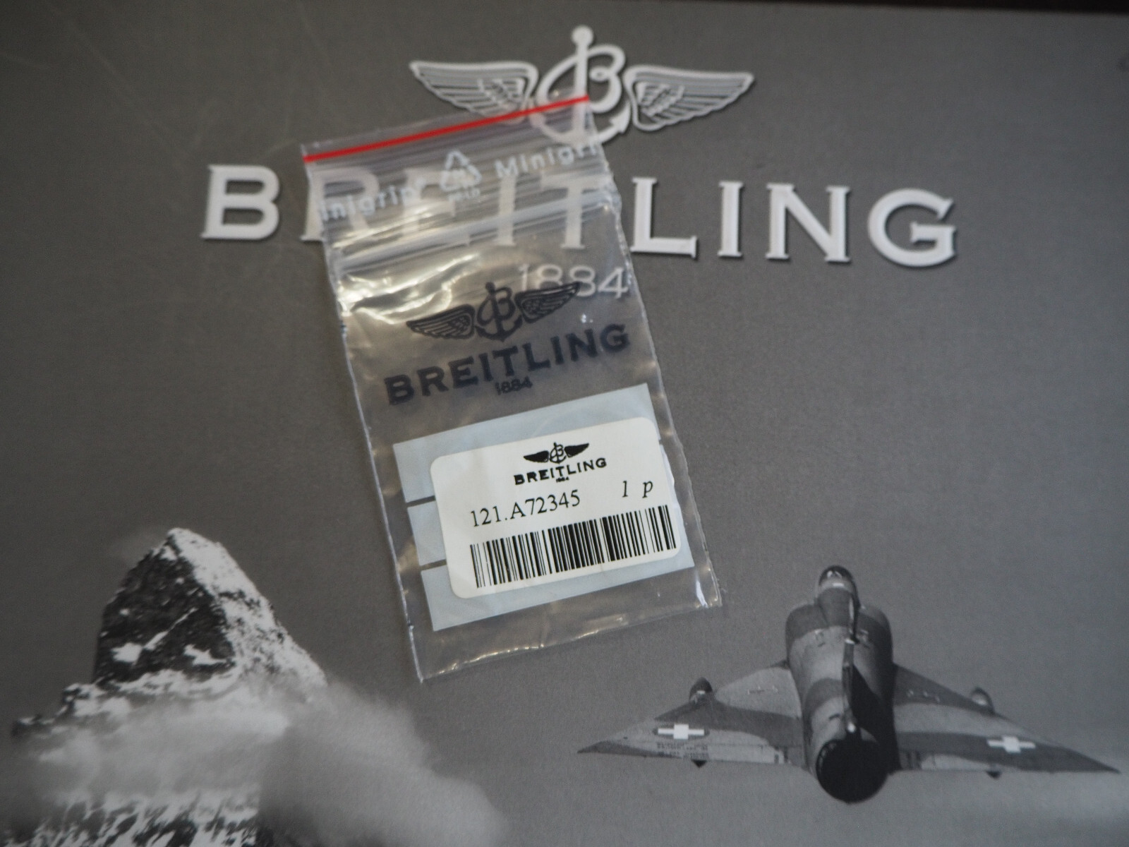 Genuine Breitling Bezel retainer spring for Callistino A72345, NEW.