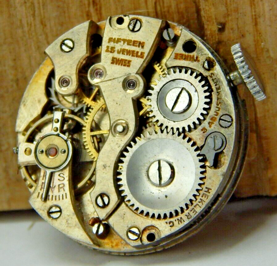 Vintage Hekler 15 jewel 3 adjustment 8/0s watch movement with dial hands & crown