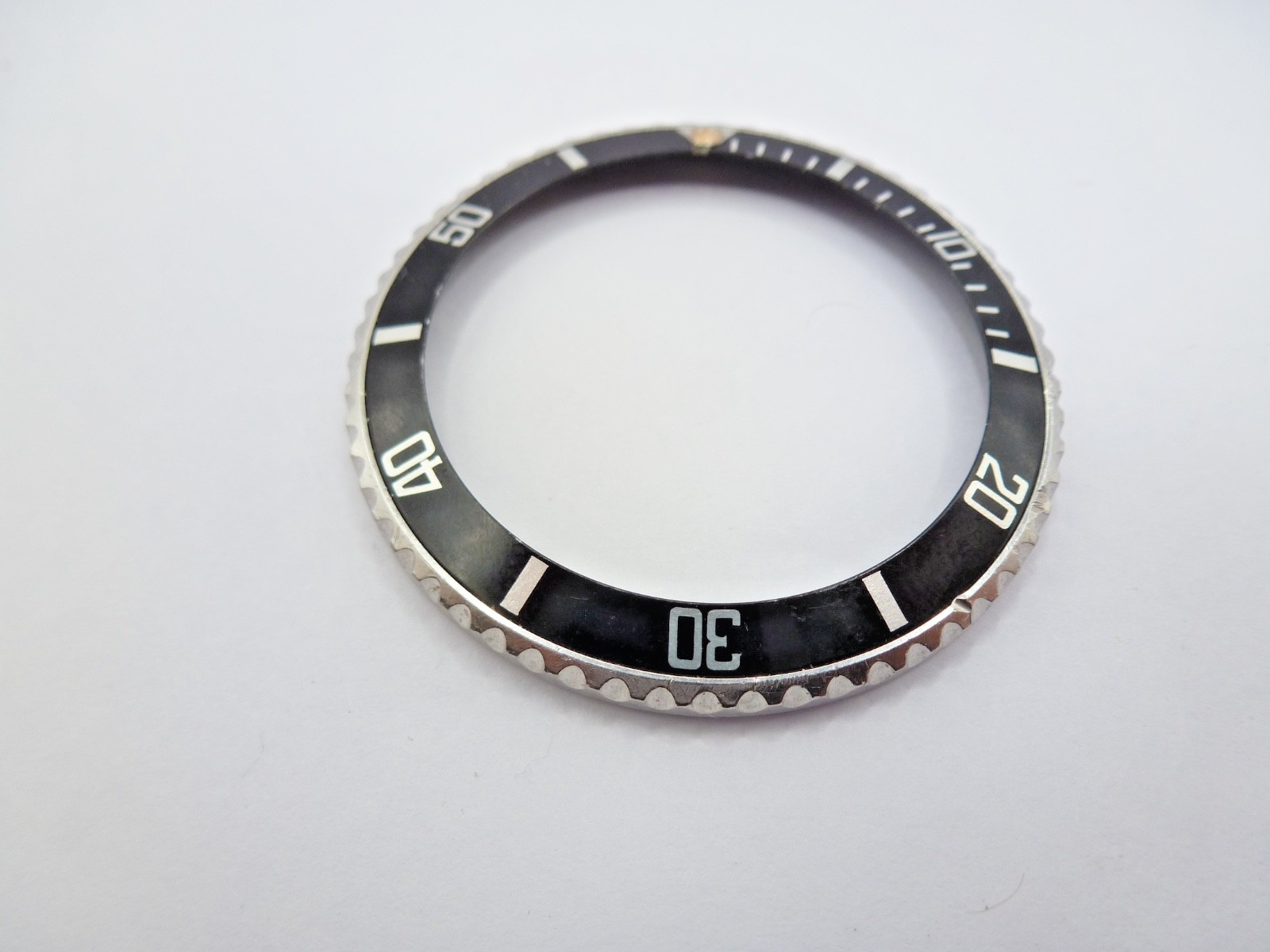 Genuine Rolex Submariner 16610/16800 complete bezel with insert vintage used .