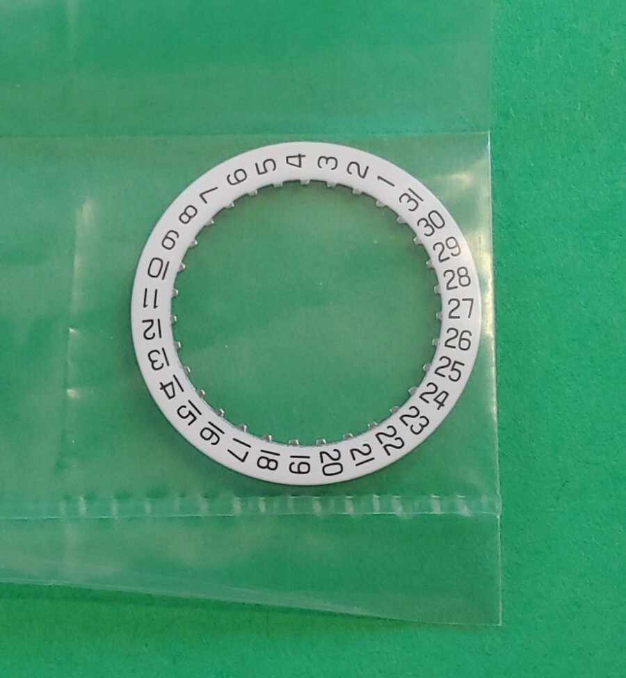 ETA 956.112 – 7.75″‘ Date Disk. White With Black Numerals. NOS. Date @3.