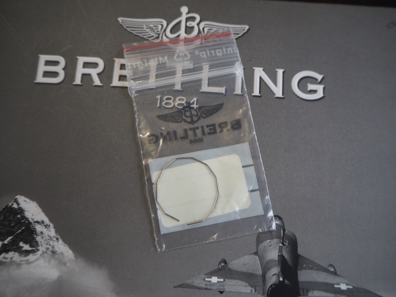 Genuine Breitling Bezel retainer spring for Callistino A72345, NEW.