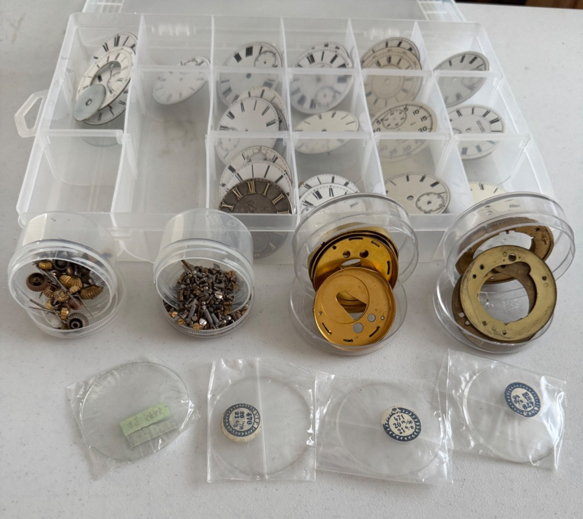 Watchmakers pocket watch dials, screws, crowns and other parts