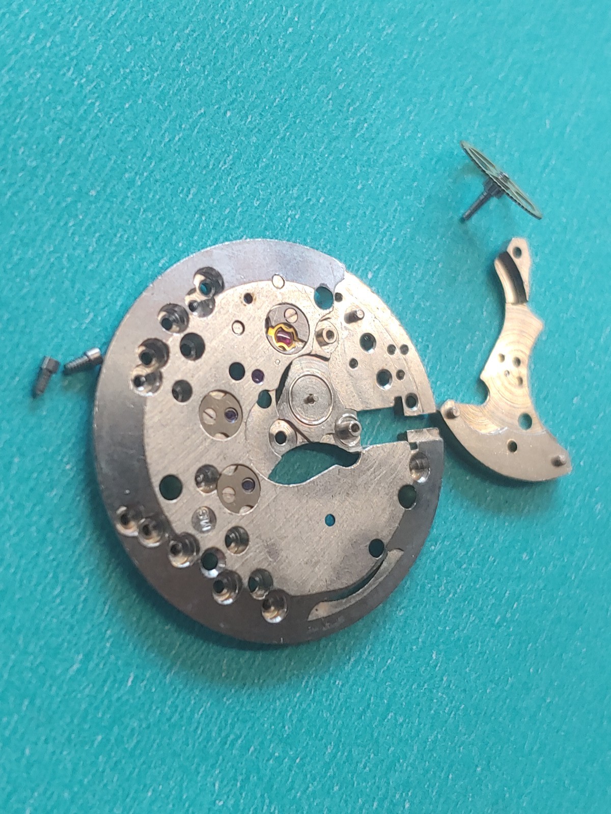 AS Cal. #1187/94 Base Plate, Minute Wheel And Bridge. Screws, Inca Jewel & Clip