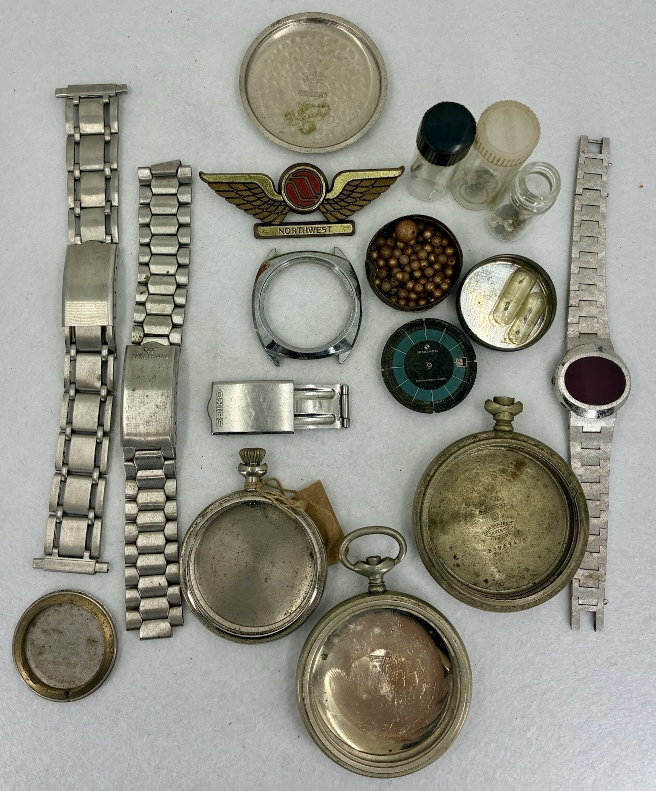Watchmaker Parts. Lot # 5. Cases, Bracelets, Balances, Mounted Jewels, Etc