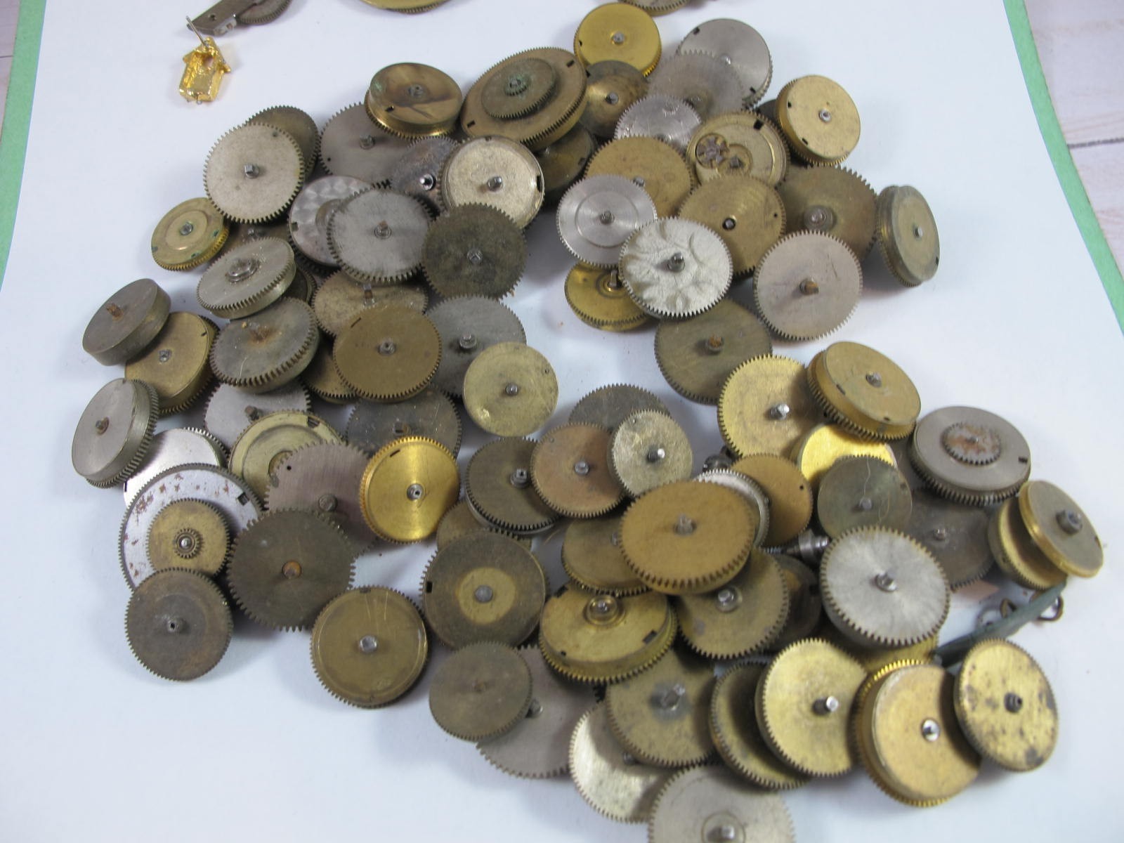 ANTIQUE GROUP OF MAINSPRING BARRELS AND BRIDGES FOR OLD POCKET WATCHES 89 PIECES