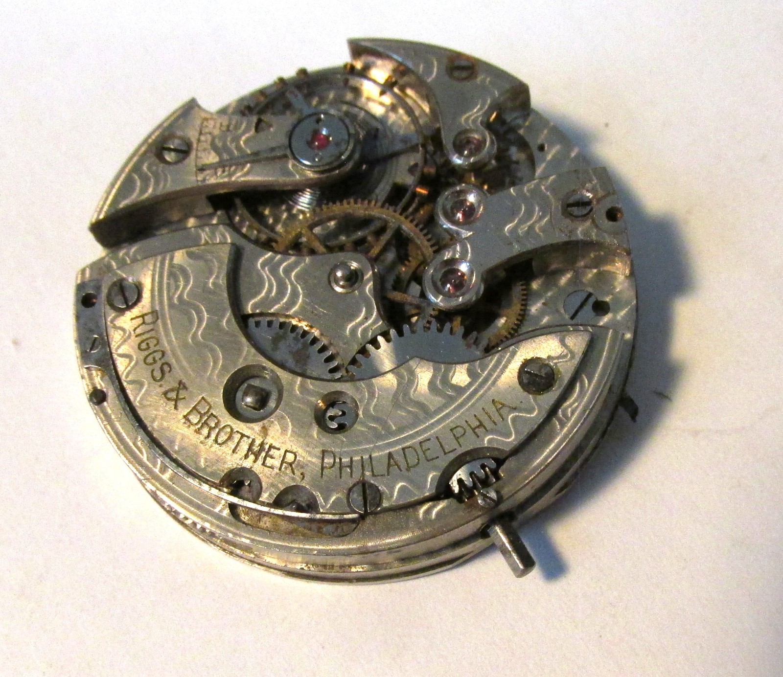 Pocket watch movement only, no case, dial or hands, private label – Riggs & Bro.