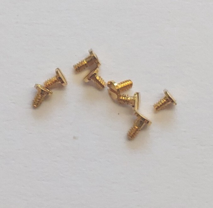 ETA 956.112 – 956.431, 556.114 NOS Original Swiss Gold Colored Screw@ Pos. Clamp