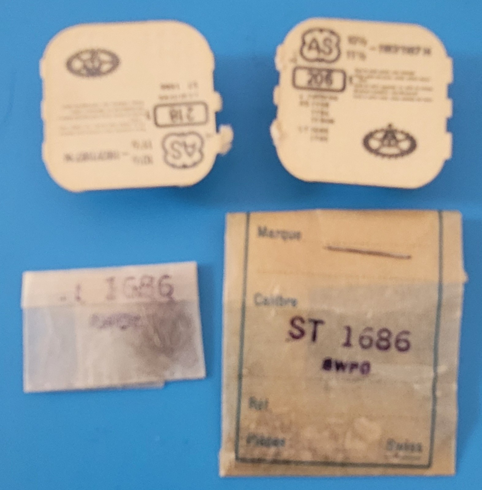 SB2-013: Lot NOS Watch Parts for AS 1686/984/1187 – Levers, Gears, Mainsprings