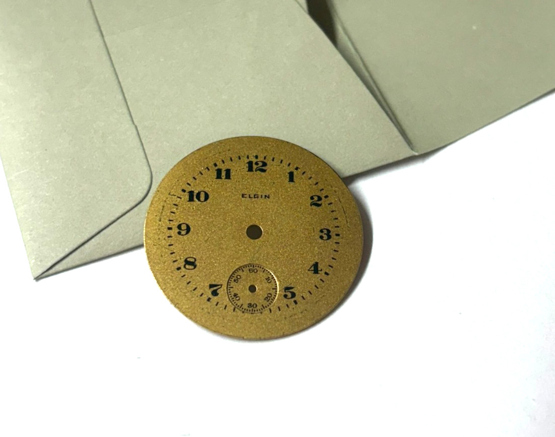 ELGIN 3/0 METAL DIAL GOLD COLOR ,,, NICE ——–D-311