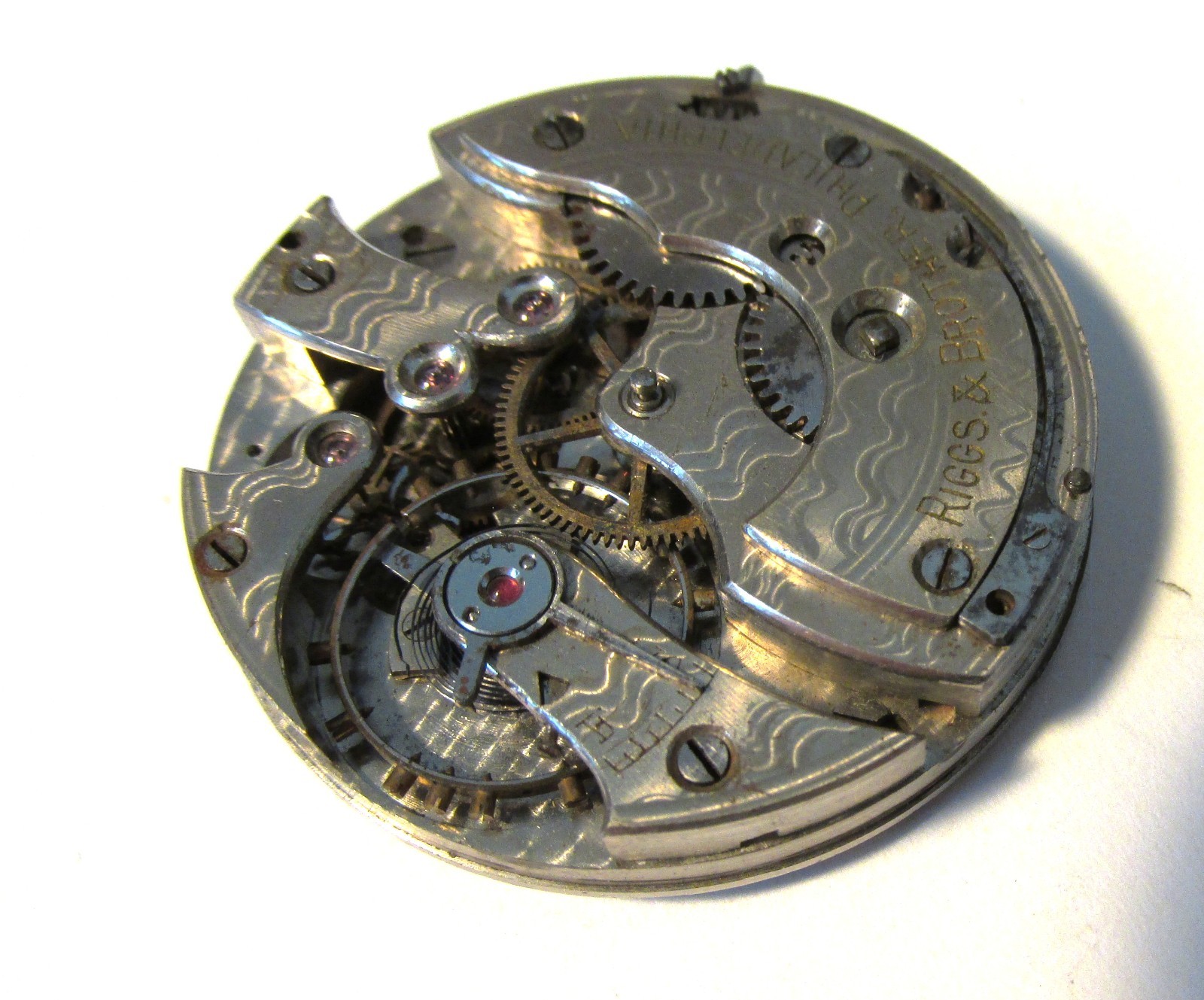 Pocket watch movement only, no case, dial or hands, private label – Riggs & Bro.