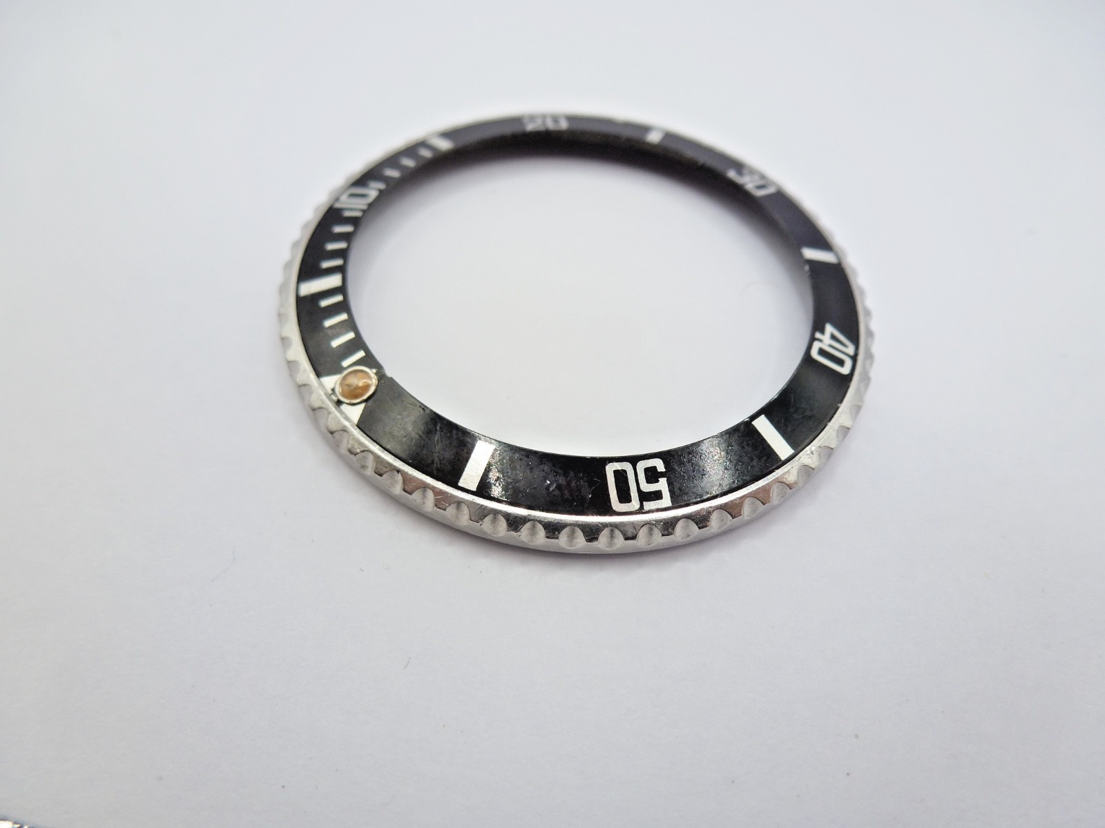 Genuine Rolex Submariner 16610/16800 complete bezel with insert vintage used .