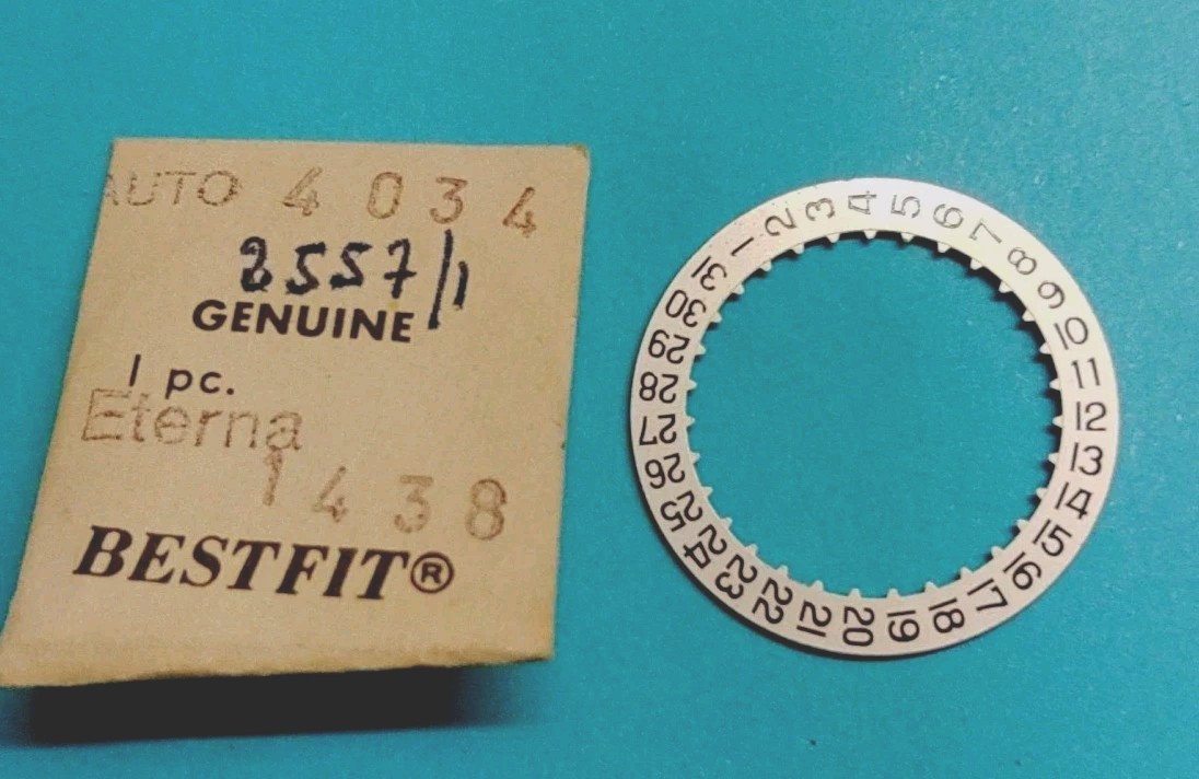 ETERNA Calibre #1438 Date @3 Disc. Part #2557/1. Black On Silver. NOS.