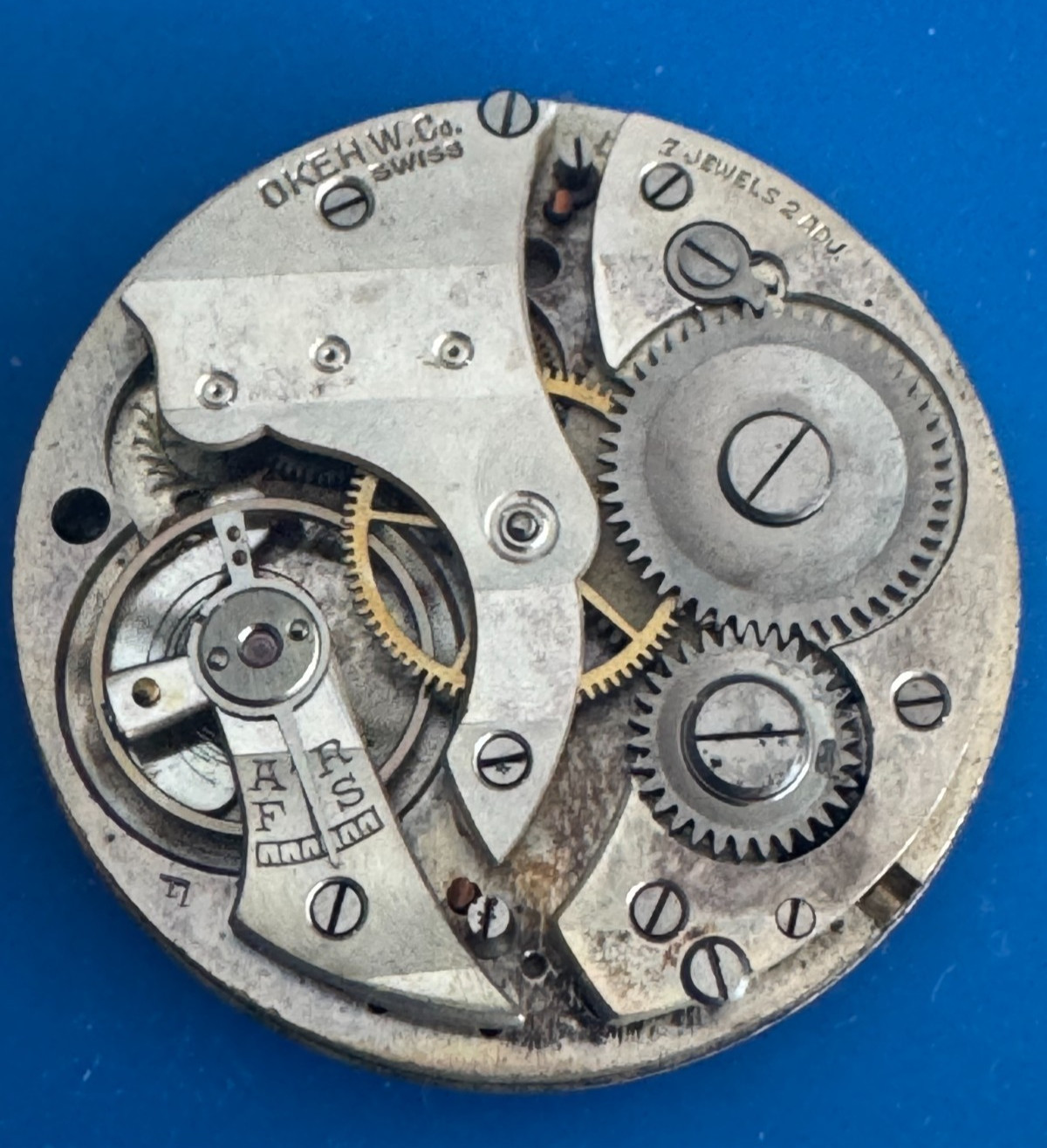 VINTAGE 39.80MM SWISS OKEH W. CO. POCKET WATCH MOVEMENT RUNS AND STOPS
